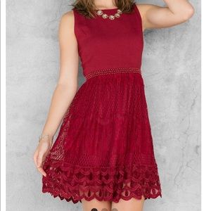Francesca’s red beaded lace dress